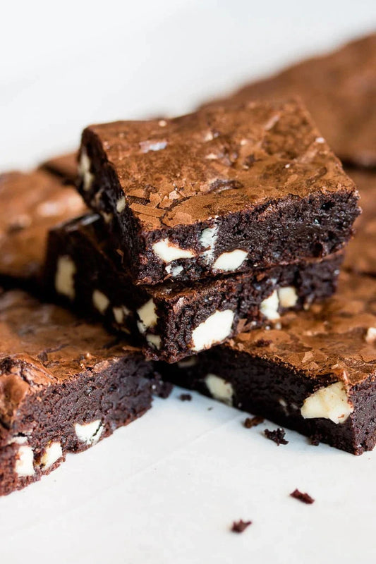 A small stack of brownies made with white chocolate chips